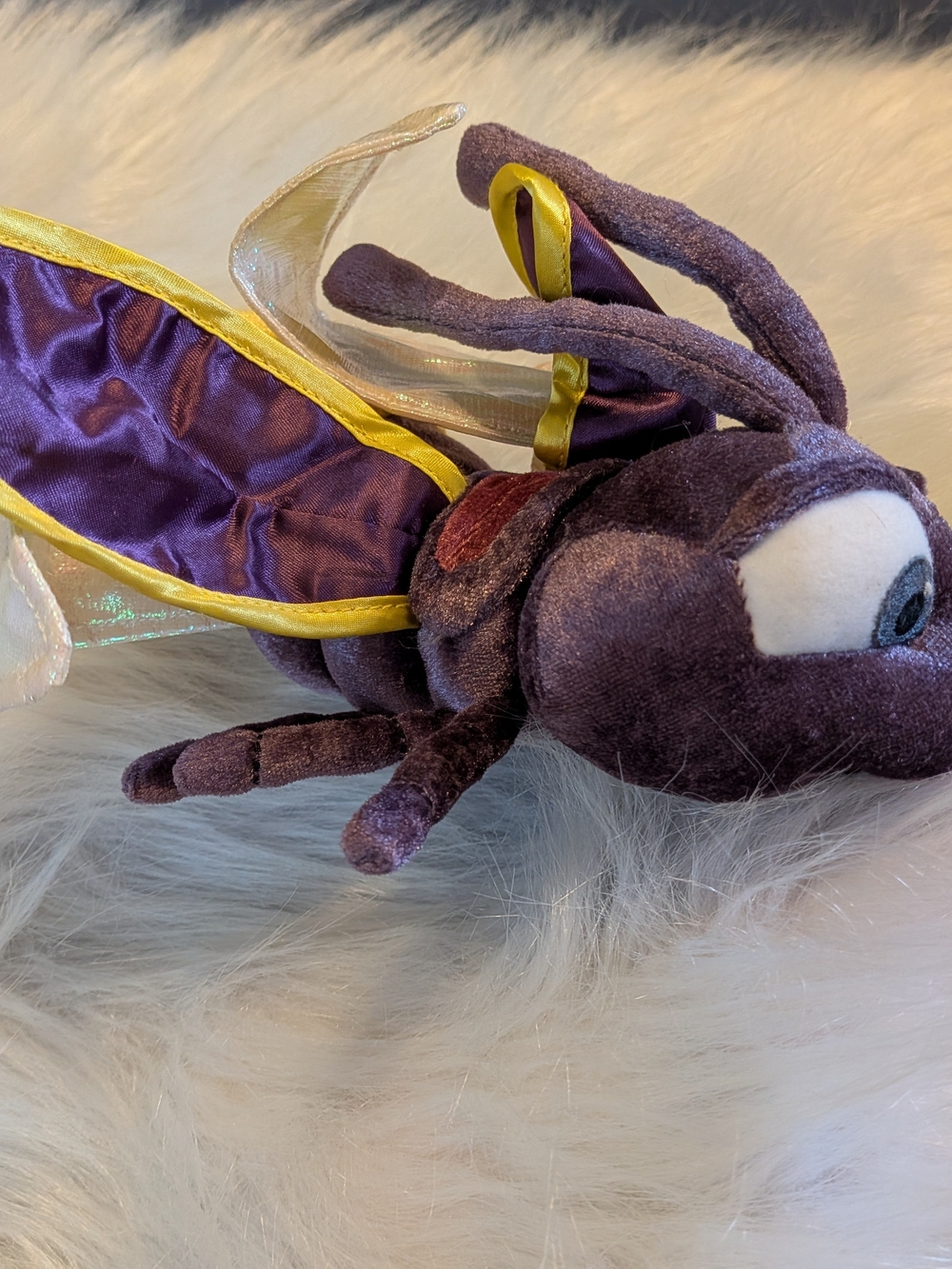 This is an authentic Disney Store Blaze the Firefly plush